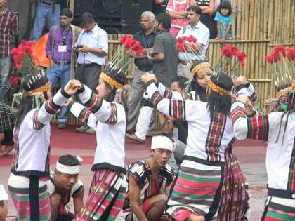 Cheraw dancers step between the bamboo poles