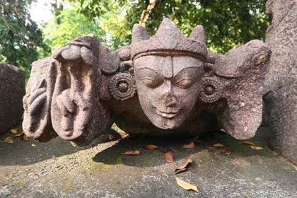 A carved head among the Deopahar ruins