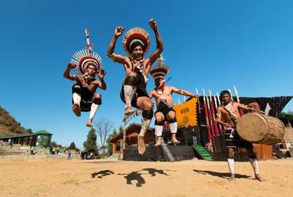 Zeliang Naga dancers in mid-leap