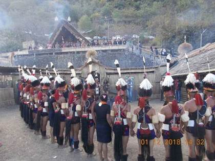 Khiamniungan Naga dancers outside their morung