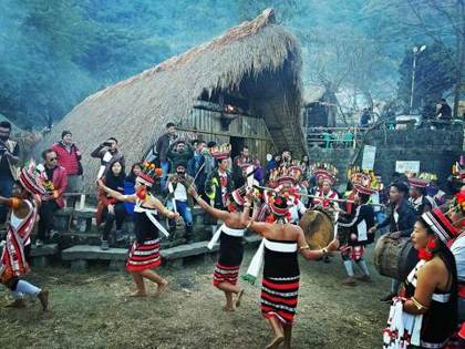 Dancers outside a morung at Kisama