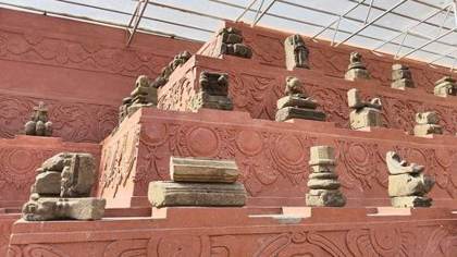 Carved stone fragments displayed at Malinithan