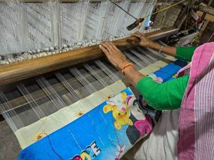 At the handloom in Sualkuchi