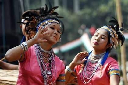 Garo dancers in feathered headdresses